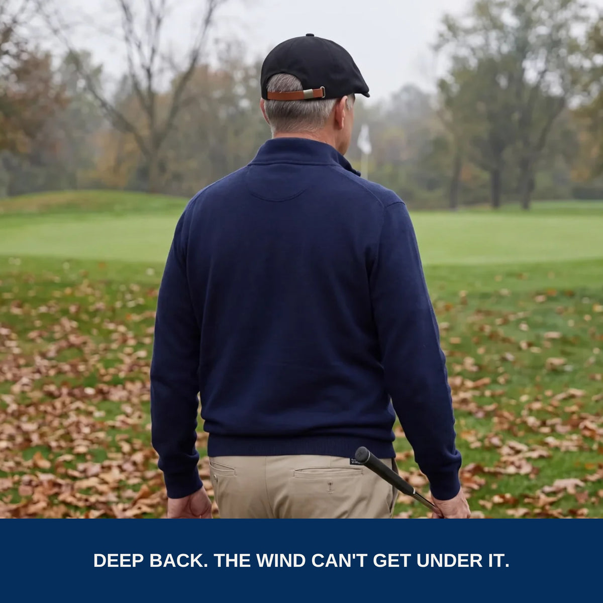 Golfer seen from behind: deep back, the wind can't get under it