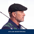Golfer wearing the black flat cap, side profile